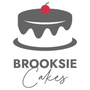 Brooksie Cakes logo with grey colored frosting and red cherry