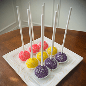 Pink, yellow and purpose dipped cake pops